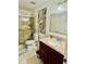 Bathroom featuring frameless glass shower and vanity sink at 2480 Brownwood Dr, Mulberry, FL 33860