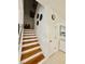 Stairway with wood steps and white risers at 2480 Brownwood Dr, Mulberry, FL 33860