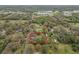 Aerial view of the property, surrounded by lush greenery, providing a glimpse of its prime location in a serene neighborhood at 820 N Carroll Rd, Lakeland, FL 33801