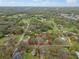 Aerial view of the lot highlighting the property's boundaries, mature trees, and the surrounding neighborhood at 820 N Carroll Rd, Lakeland, FL 33801