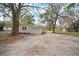 View of the backyard with mature tree coverage at 820 N Carroll Rd, Lakeland, FL 33801