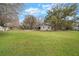 Single story home with a large backyard and mature trees at 820 N Carroll Rd, Lakeland, FL 33801