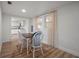 Charming dining area with wood floors and white trim, located next to kitchen featuring stainless appliances at 820 N Carroll Rd, Lakeland, FL 33801