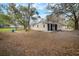 A charming single-story home with a well-manicured lawn and mature trees at 820 N Carroll Rd, Lakeland, FL 33801