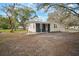 Charming single-story home featuring a covered entrance, painted brickwork, and a well-maintained yard at 820 N Carroll Rd, Lakeland, FL 33801