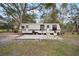 RV on a lot, complete with concrete patio, offering convenient outdoor living and a comfortable mobile home experience at 820 N Carroll Rd, Lakeland, FL 33801