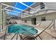 A beautiful in-ground pool surrounded by a screened enclosure offering a private outdoor space at 913 Parasol Pl, Kissimmee, FL 34759