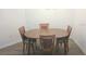 Cozy dining room featuring a wooden table with four chairs, perfect for intimate meals at 1974 Lockett Ln, The Villages, FL 34762