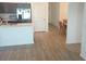 Open concept kitchen with stainless appliances, a dining area, and hardwood floors at 1974 Lockett Ln, The Villages, FL 34762