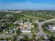 Aerial view of the property near lush green landscaping, highway and crossroads at 222 Carpenters Way # 9, Lakeland, FL 33805