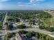 Aerial view shows the community surrounded by lush landscaping and near crossroads at 222 Carpenters Way # 9, Lakeland, FL 33805