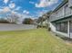 The large lawn behind the condos with a tall privacy wall at 222 Carpenters Way # 9, Lakeland, FL 33805