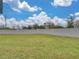 A large backyard with tall privacy wall and grass at 222 Carpenters Way # 9, Lakeland, FL 33805