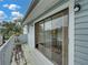View from balcony featuring weathered wooden deck, railings, and sliding glass door at 222 Carpenters Way # 9, Lakeland, FL 33805