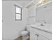 Bathroom featuring white sink, toilet, cabinets and tile flooring at 222 Carpenters Way # 9, Lakeland, FL 33805