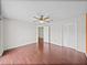 Spacious bedroom with hardwood floors, a ceiling fan, and closet at 222 Carpenters Way # 9, Lakeland, FL 33805