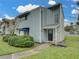 Charming townhouse features a well-maintained lawn and beautiful shrubbery enhancing its curb appeal at 222 Carpenters Way # 9, Lakeland, FL 33805
