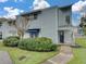 Charming townhouse features a well-maintained lawn and beautiful shrubbery enhancing its curb appeal at 222 Carpenters Way # 9, Lakeland, FL 33805