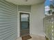 Inviting front door with screen provides ventilation and natural light, welcoming guests to this charming home at 222 Carpenters Way # 9, Lakeland, FL 33805
