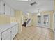 Kitchen with skylight providing natural light adjacent to stairwell and backyard access at 222 Carpenters Way # 9, Lakeland, FL 33805