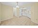Bright kitchen with white cabinets, appliances, and tile flooring and lots of natural light at 222 Carpenters Way # 9, Lakeland, FL 33805