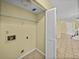 Laundry room with shelving and washer/dryer hookups at 222 Carpenters Way # 9, Lakeland, FL 33805
