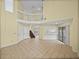 Open-concept living room with tile flooring, bright lighting, and staircase offer versatile living space at 222 Carpenters Way # 9, Lakeland, FL 33805