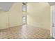 Bright living room with neutral walls, tile flooring, and large windows create a welcoming, spacious environment at 222 Carpenters Way # 9, Lakeland, FL 33805