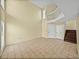 Spacious living room with tile floors, staircase, and bright lighting, creating a welcoming atmosphere at 222 Carpenters Way # 9, Lakeland, FL 33805