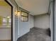 Tiled screened-in porch and exterior door at 222 Carpenters Way # 9, Lakeland, FL 33805