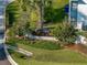 Community sign surrounded by lush landscaping at 222 Carpenters Way # 9, Lakeland, FL 33805