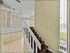 View of wooden staircase with white railings and a window in a home interior at 222 Carpenters Way # 9, Lakeland, FL 33805