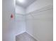 Walk-in closet with wire shelving and neutral carpet at 222 Carpenters Way # 9, Lakeland, FL 33805