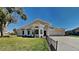 Charming single-story home with well-manicured lawn and inviting curb appeal at 512 Lost Creek Ct, Kissimmee, FL 34743