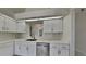 Bright kitchen with modern appliances, white cabinets, and ample counter space at 512 Lost Creek Ct, Kissimmee, FL 34743