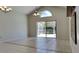 Spacious living room with tile floors and sliding doors to the backyard at 512 Lost Creek Ct, Kissimmee, FL 34743