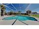 Relaxing screened-in pool area with lush landscaping for privacy at 512 Lost Creek Ct, Kissimmee, FL 34743