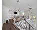 Bright living room with dark floors, built-in shelves, modern lighting, and plenty of natural light at 5406 Baytowne Place, Oviedo, FL 32765