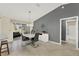 Dining space with a modern table, stylish chandelier, and convenient access to the kitchen at 2337 St George Ave, The Villages, FL 32162