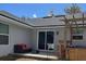 Inviting backyard patio with a hot tub, pergola, outdoor seating, and a sliding glass door leading indoors at 858 Lafayette Ln, Lakeland, FL 33805