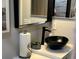 Bathroom featuring a vessel sink, modern faucet, and decorative accents for a contemporary look at 858 Lafayette Ln, Lakeland, FL 33805