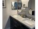 Modern bathroom featuring double sinks with marble countertops and oval mirrors, offering a clean and stylish design at 858 Lafayette Ln, Lakeland, FL 33805