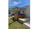 Backyard view of a wooden hot tub and pergola, set on a concrete patio at 858 Lafayette Ln, Lakeland, FL 33805