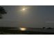 Night view of a lake illuminated by a bright moon over the serene water at 858 Lafayette Ln, Lakeland, FL 33805