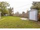 Well-maintained backyard with a shed and mature trees at 1729 Elk Dr, Lakeland, FL 33801