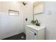 Bathroom featuring a walk-in shower with black fixtures, a vanity, and updated tile work at 1729 Elk Dr, Lakeland, FL 33801