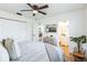 Bedroom with a large bed, closet, and a view into a bright bathroom at 1729 Elk Dr, Lakeland, FL 33801
