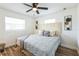 Bedroom featuring a large bed, natural light, and decorative wall art at 1729 Elk Dr, Lakeland, FL 33801