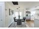 Elegant dining area with modern light fixture flows into the updated kitchen at 1729 Elk Dr, Lakeland, FL 33801