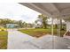 Spacious front yard with long driveway and mature trees at 1729 Elk Dr, Lakeland, FL 33801